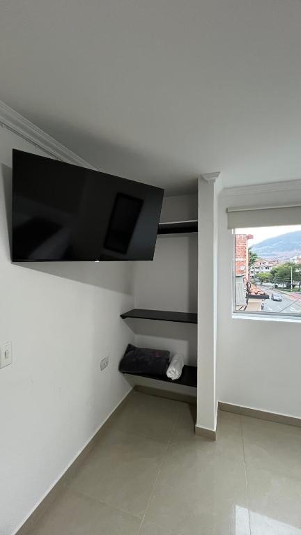 TV a/nebo společenská místnost v ubytování Hotel Medellín 66