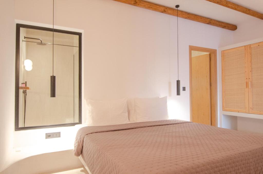 Ένα ή περισσότερα κρεβάτια σε δωμάτιο στο ARC suites