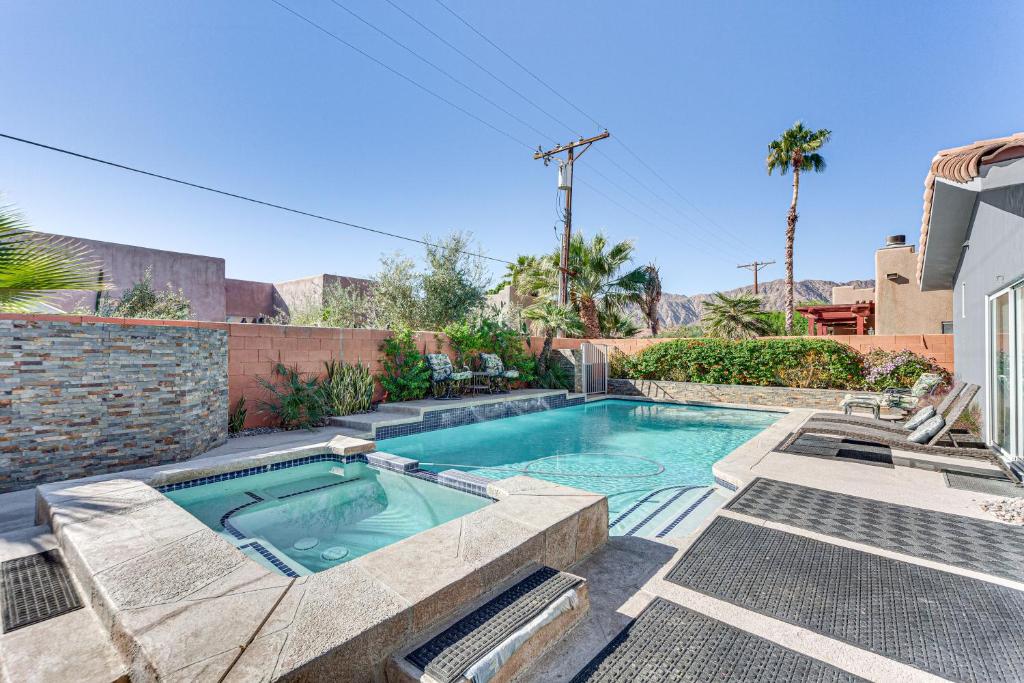 a swimming pool in the backyard of a house at Heated Pool at 3 BR Home 5 Mi to Coachella! in La Quinta