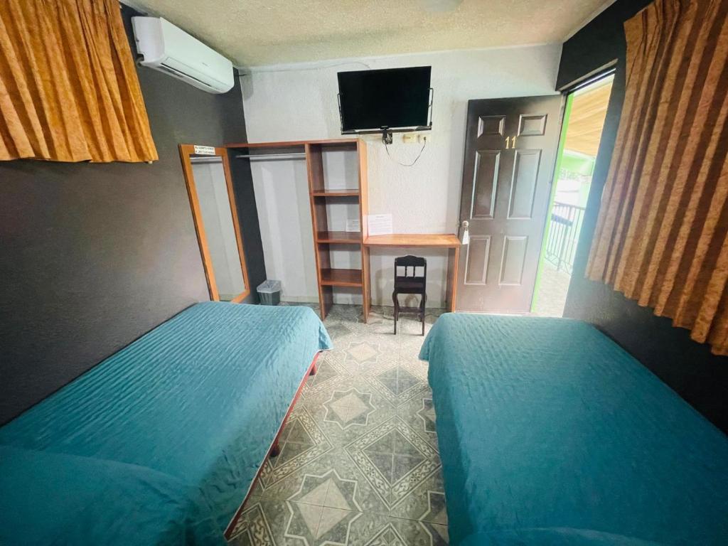 TV a/nebo společenská místnost v ubytování Hotel Lol Tun
