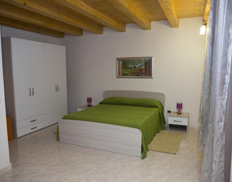 Posteľ alebo postele v izbe v ubytovaní Casa Vacanze Calafarina