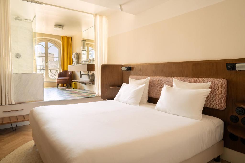 Postel nebo postele na pokoji v ubytování Hôtel du Sentier