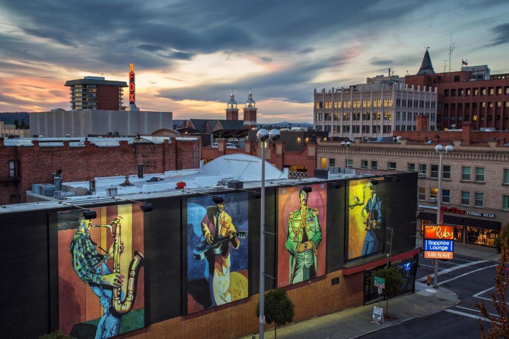 a building with paintings on the side of it in a city at Hotel Ruby in Spokane