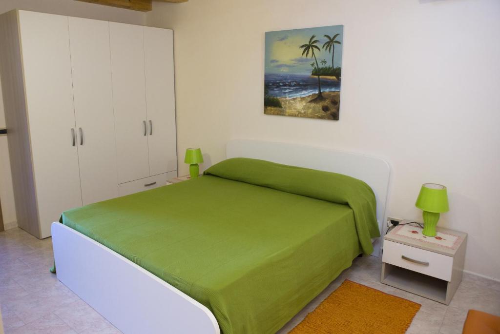 Posteľ alebo postele v izbe v ubytovaní Casa Vacanze Calafarina
