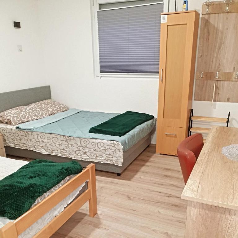 Postel nebo postele na pokoji v ubytování Prenoćište, sobe AN-KA