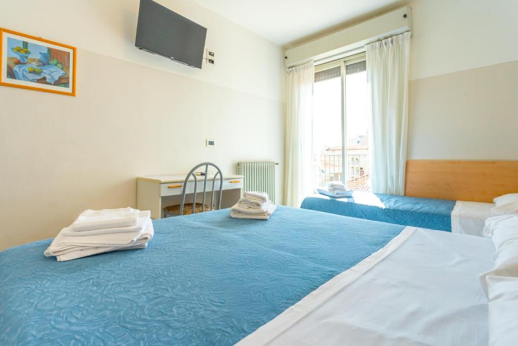 Postel nebo postele na pokoji v ubytování Hotel Selene - Vista Mare