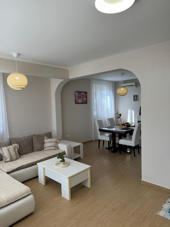 a living room with a couch and a table at Lemon Villa in Bar