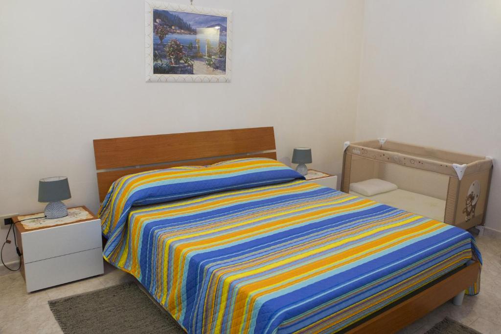 Posteľ alebo postele v izbe v ubytovaní Casa Vacanze Calafarina