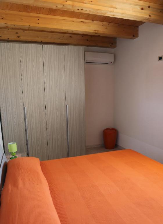 Posteľ alebo postele v izbe v ubytovaní Casa Vacanze Calafarina
