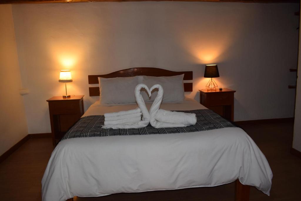 Rúm í herbergi á Huascaran Casa Boutique San Blas