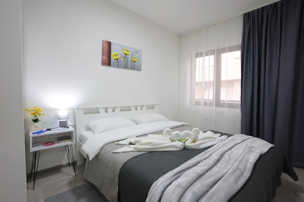 Postel nebo postele na pokoji v ubytování Ivan's guesthouse