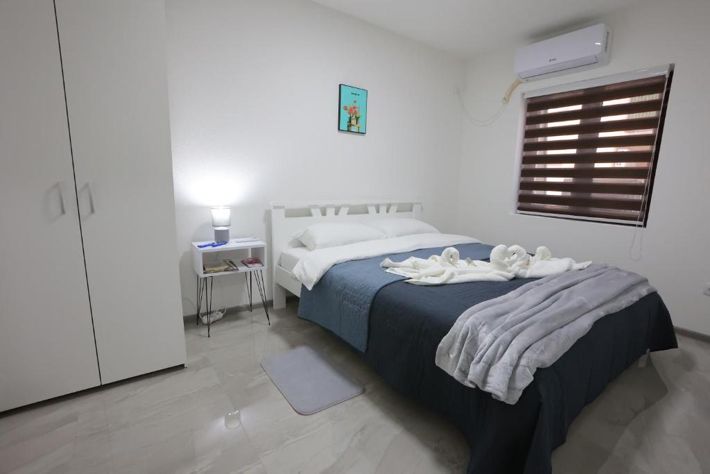 Postel nebo postele na pokoji v ubytování Ivan's guesthouse