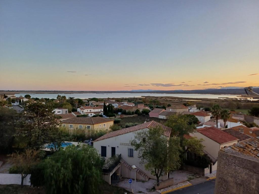 an aerial view of a small town at sunset at maison du portail vieil in Vendres