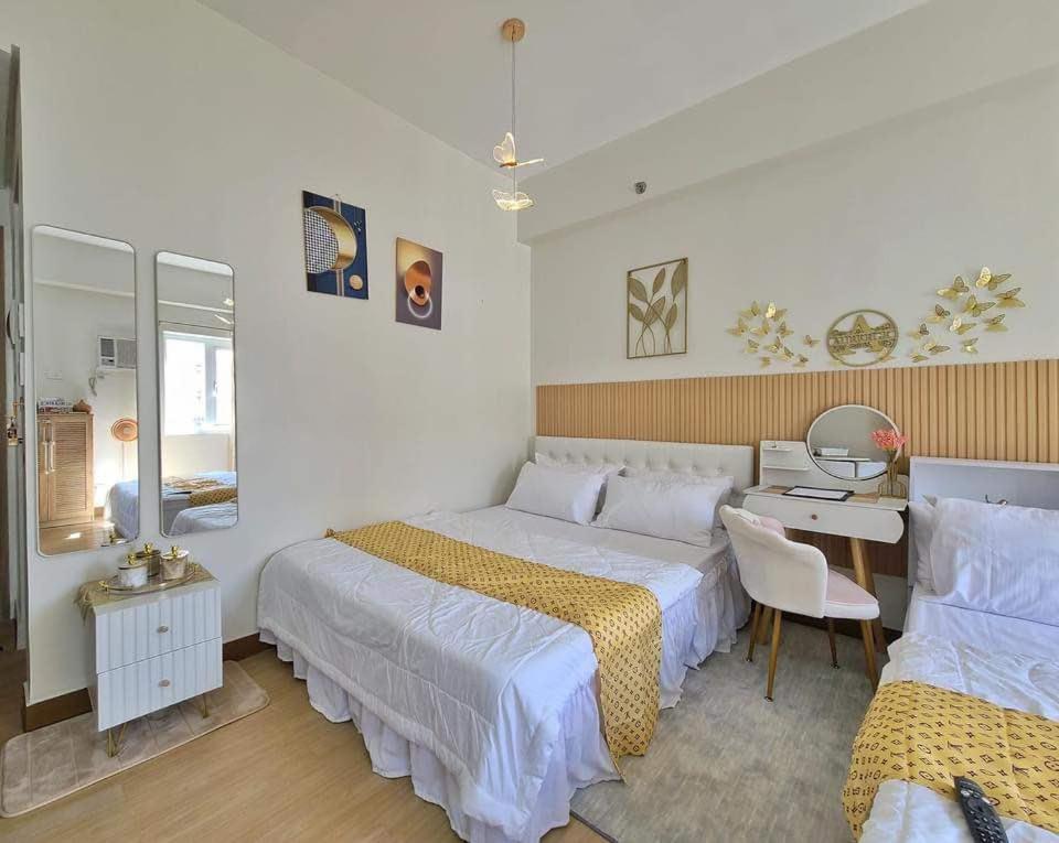Postel nebo postele na pokoji v ubytování Auberge Condotels at SMDC Hope Residences
