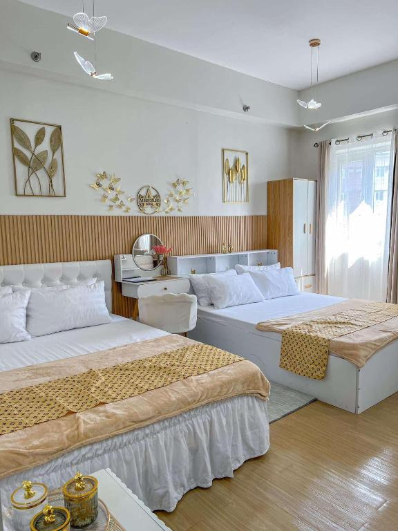 Postel nebo postele na pokoji v ubytování Auberge Condotels at SMDC Hope Residences