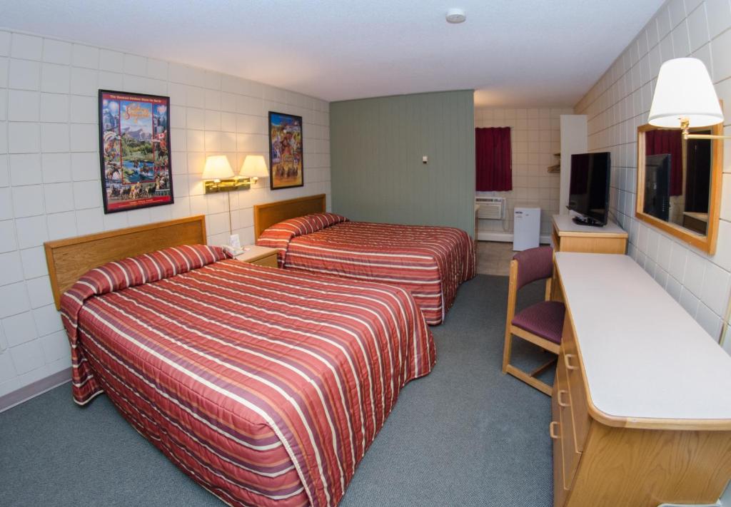 Postel nebo postele na pokoji v ubytování Plains Motel