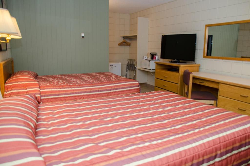 Postel nebo postele na pokoji v ubytování Plains Motel
