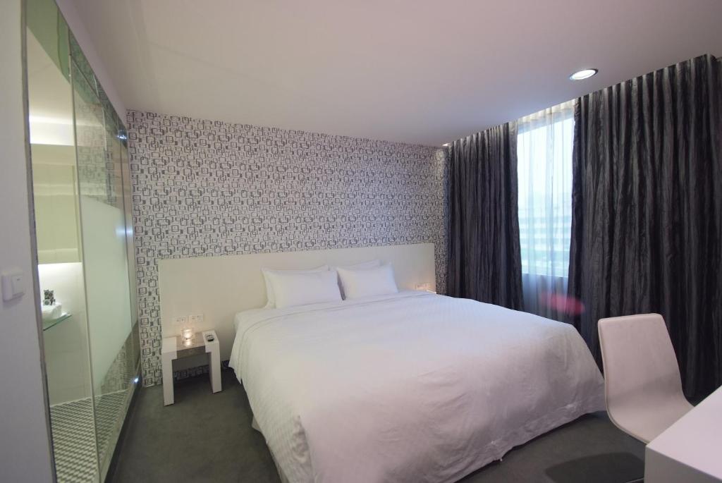 Postel nebo postele na pokoji v ubytování Hotel Purity