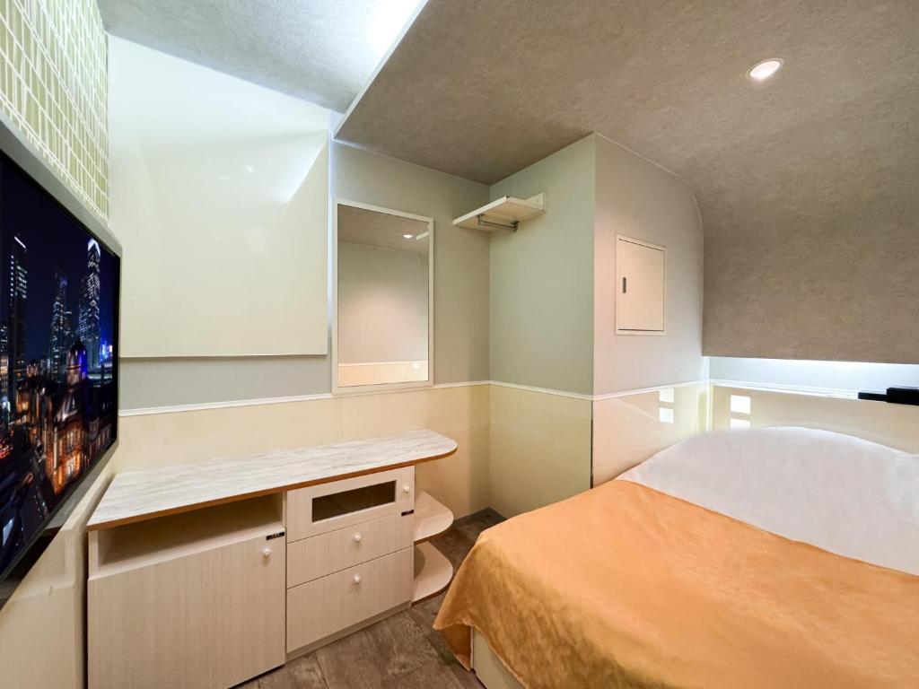 Postel nebo postele na pokoji v ubytování Hotel Century