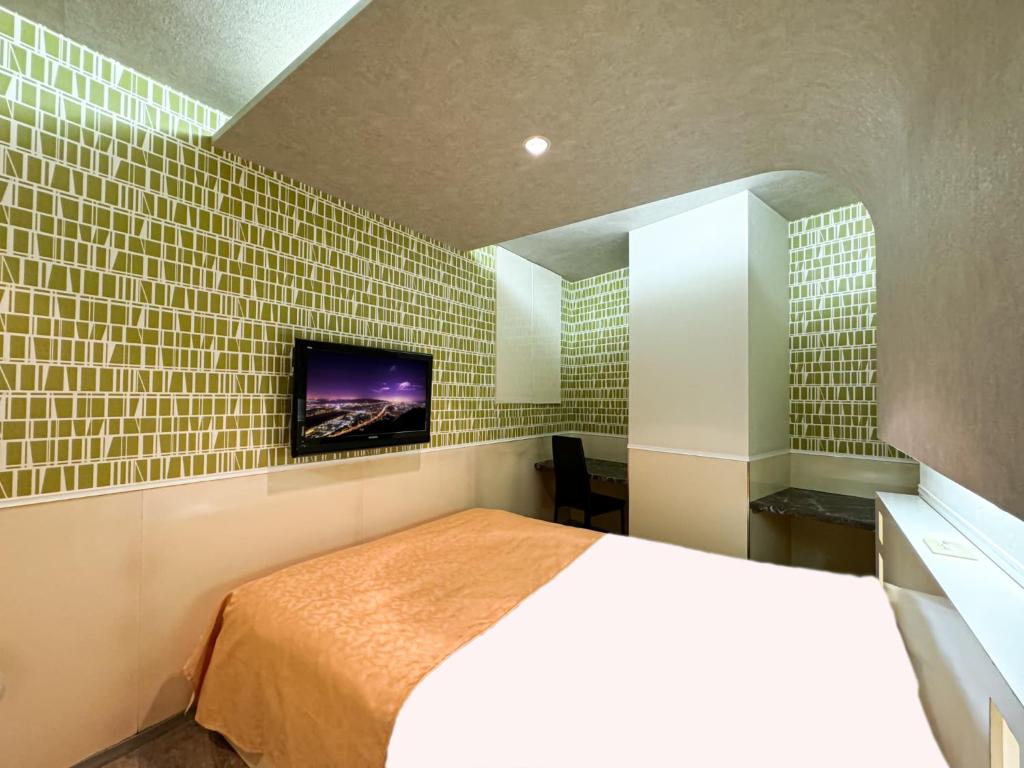 Postel nebo postele na pokoji v ubytování Hotel Century