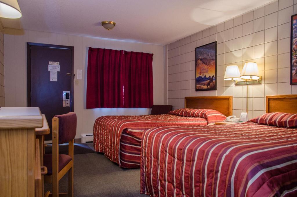 Postel nebo postele na pokoji v ubytování Plains Motel