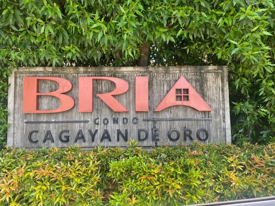 a sign for a barn with a red house on it at Classy Condo in CDO in Cagayan de Oro