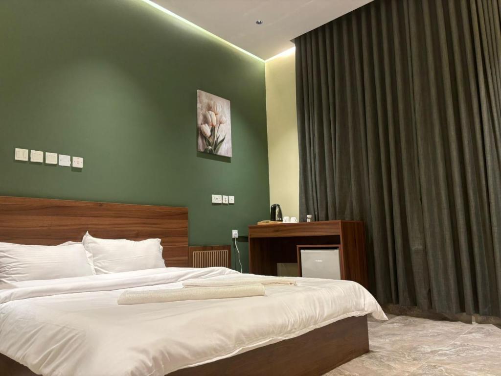Postel nebo postele na pokoji v ubytování Al Bayan Palms