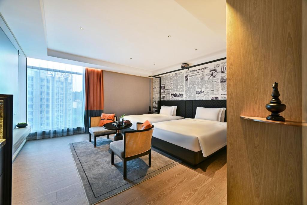Postel nebo postele na pokoji v ubytování Arthur Hotel Luogang Xiangang Metro Guangzhou-Free Breakfast and Free Afternoon Tea