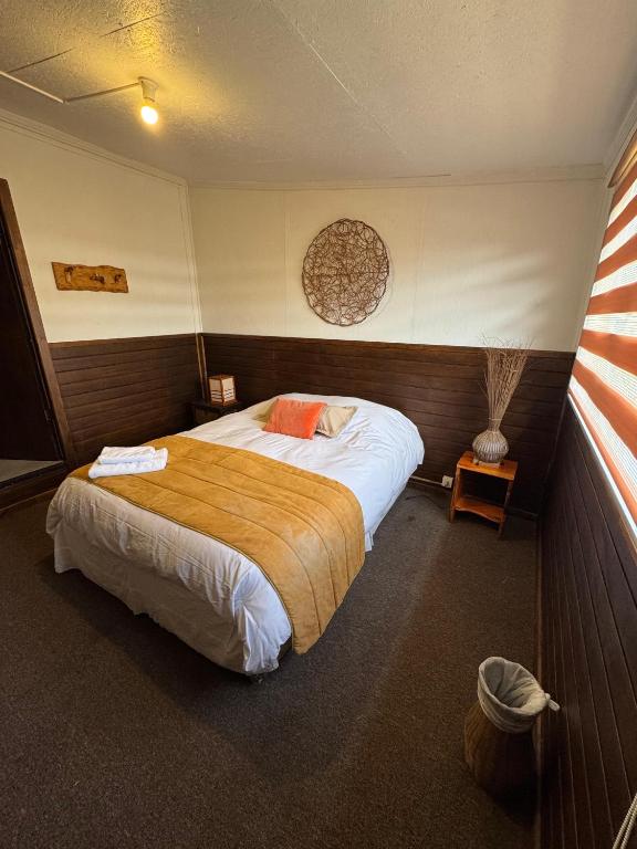 Postel nebo postele na pokoji v ubytování Hostal Amerindia