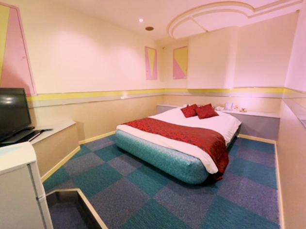 Postel nebo postele na pokoji v ubytování HOTEL K's GOMANGOKU adult only