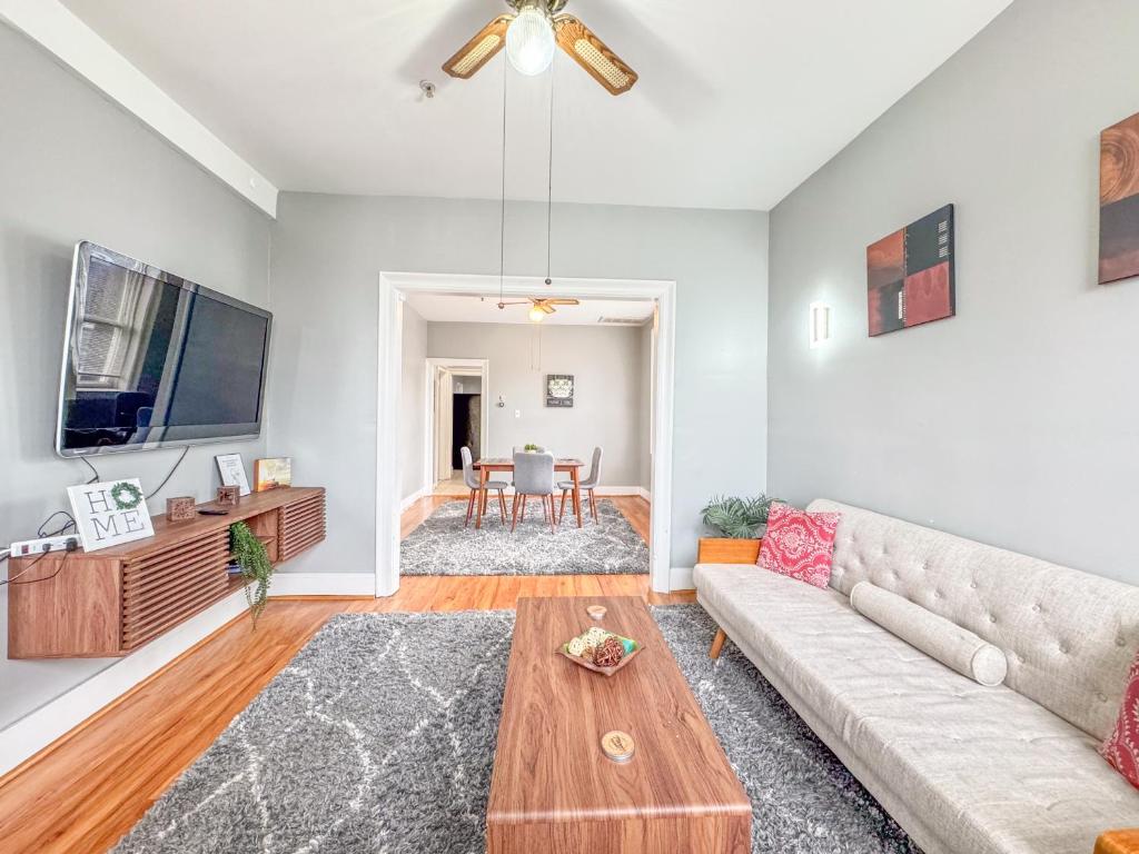 a living room with a couch and a table at 3 bed 1 bath FREE parking near NYC in North Bergen