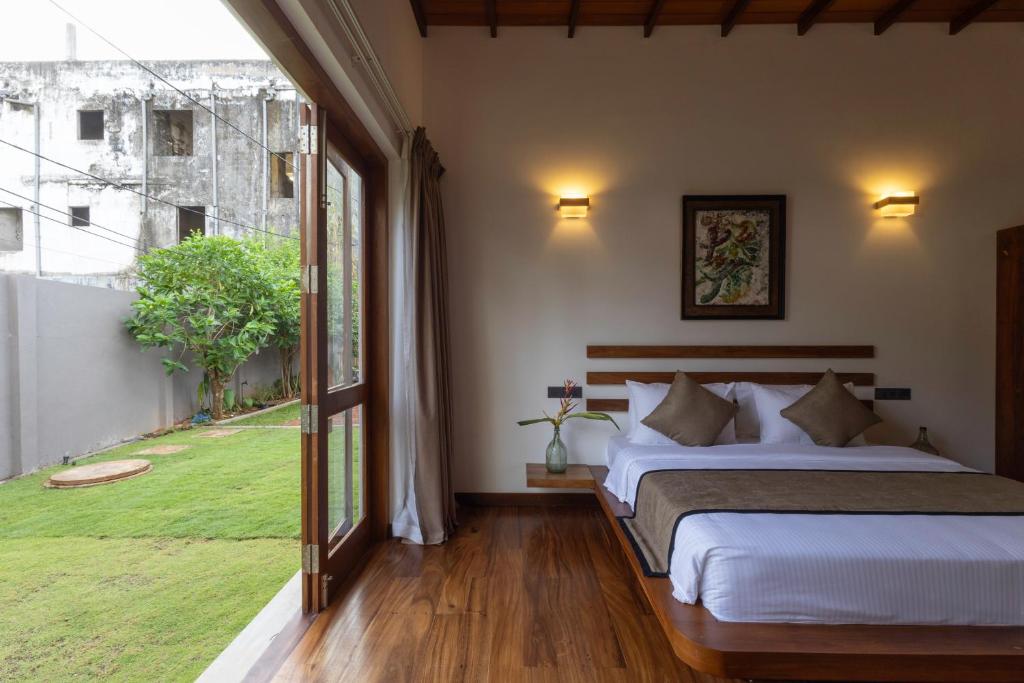 Letto o letti in una camera di Mudliyar House