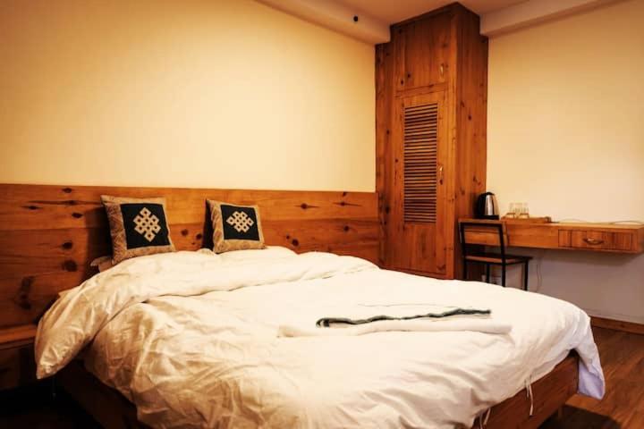 Postel nebo postele na pokoji v ubytování Sinpa Home Pilachhen
