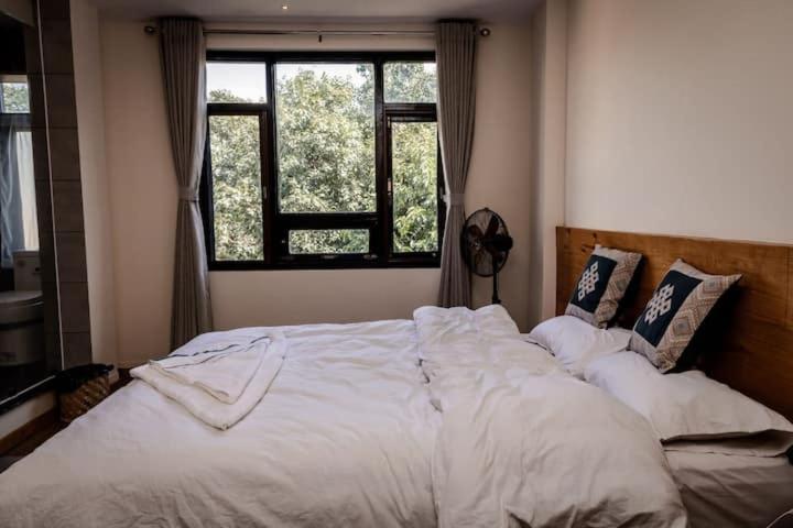 Postel nebo postele na pokoji v ubytování Sinpa Home Pilachhen
