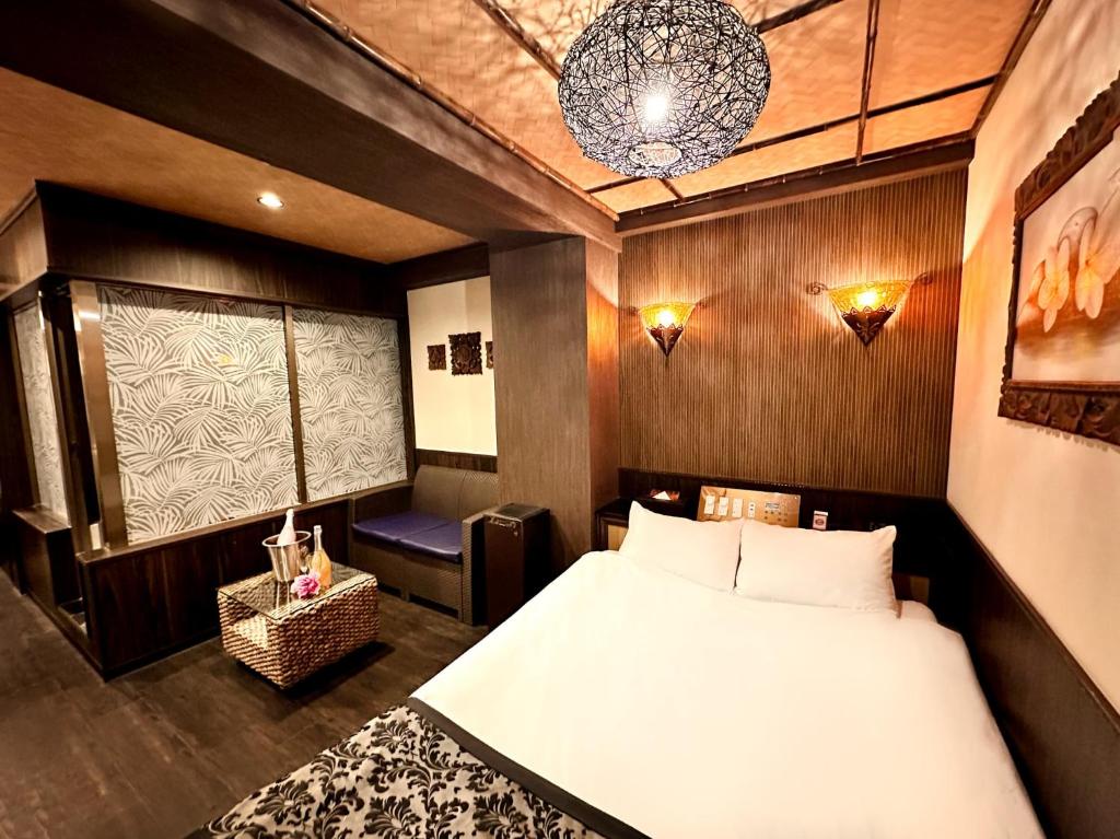 Postel nebo postele na pokoji v ubytování Hotel Gran Bali Resort