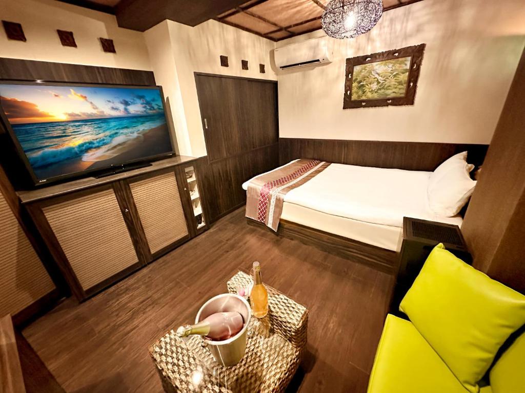 Postel nebo postele na pokoji v ubytování Hotel Gran Bali Resort