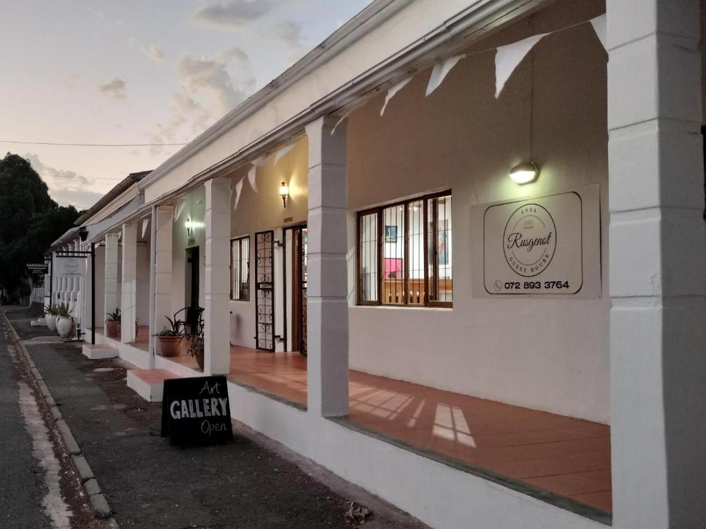 a building with a sign on the side of it at Rusgenot - Richmond, Karoo in Richmond