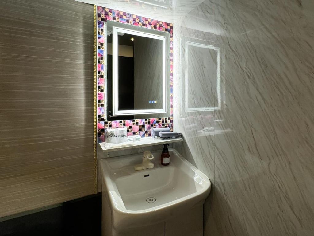 Koupelna v ubytování Hotel Amethyst