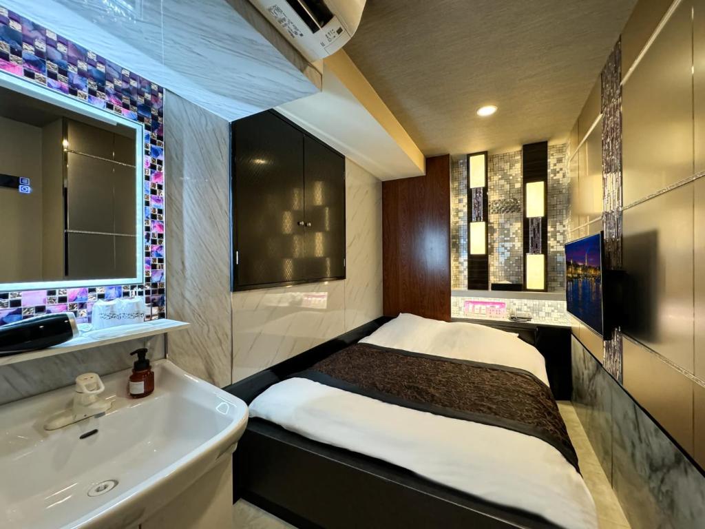 Postel nebo postele na pokoji v ubytování Hotel Amethyst