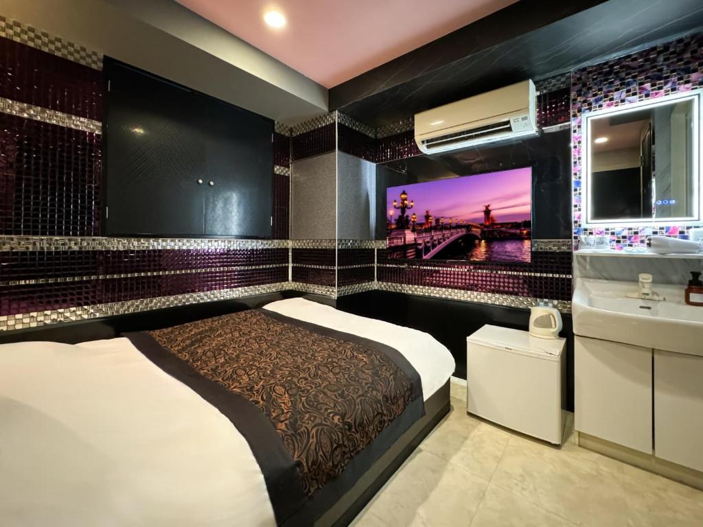 Postel nebo postele na pokoji v ubytování Hotel Amethyst