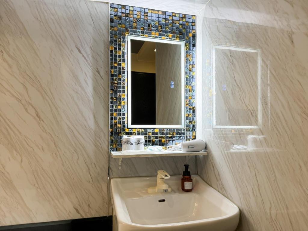 Koupelna v ubytování Hotel Amethyst