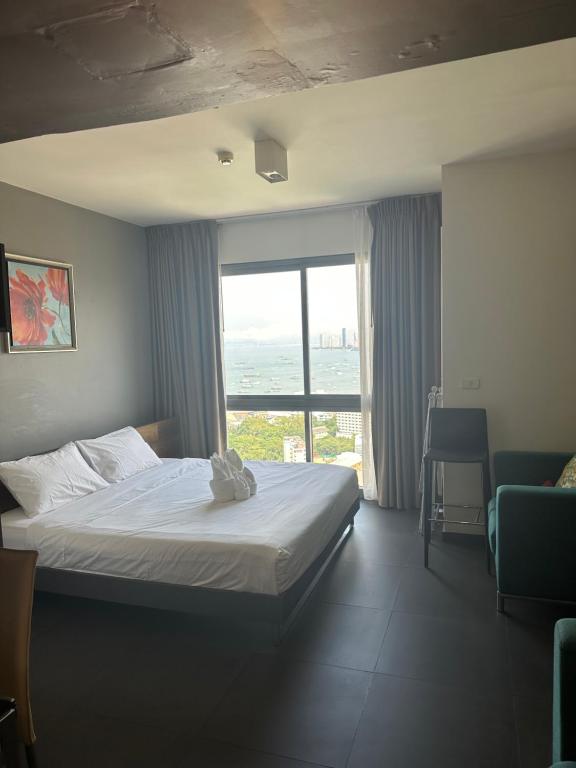Postel nebo postele na pokoji v ubytování unixx seaview hotel