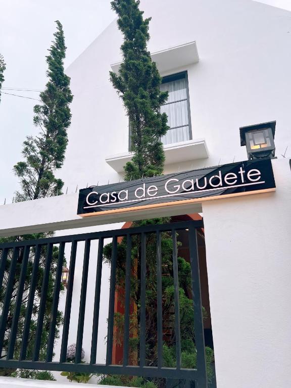 a sign on the front of a building at Casa de Gaudete 3 Bedroom King Size Villa Lembang in Genteng