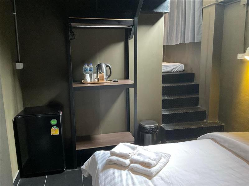 Postel nebo postele na pokoji v ubytování Capsule Hostel Chiangkhan