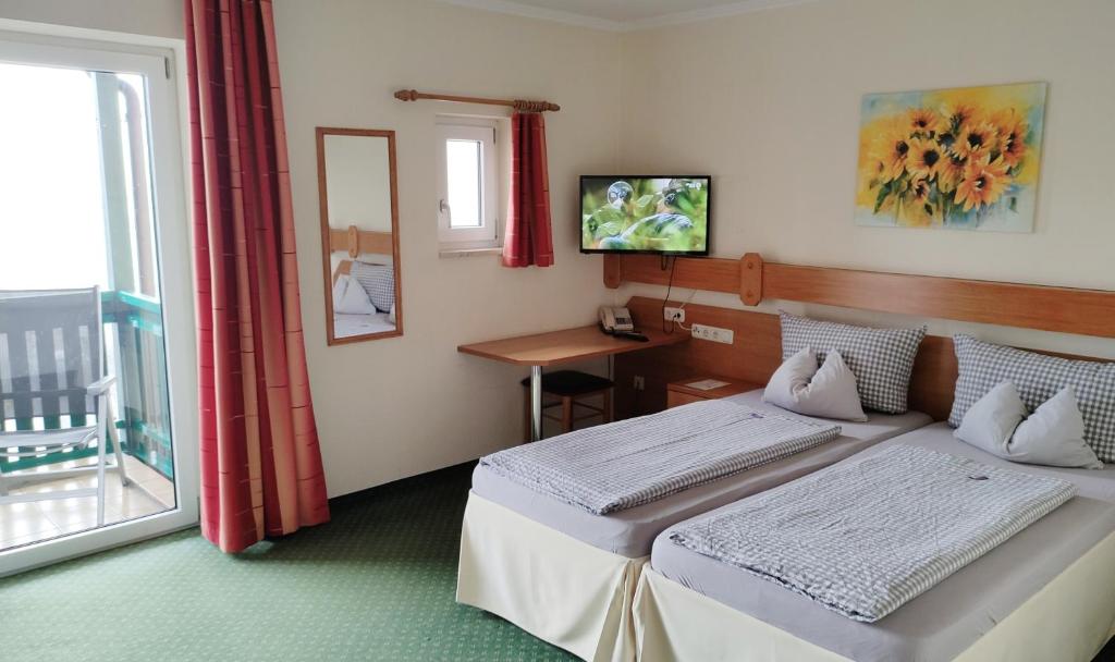 Postel nebo postele na pokoji v ubytování Hotel Fortuna