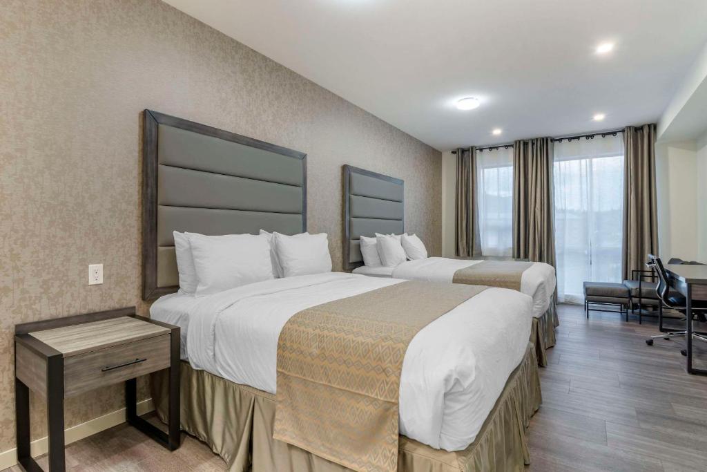 Postel nebo postele na pokoji v ubytování The Hue Hotel, Ascend Hotel Collection
