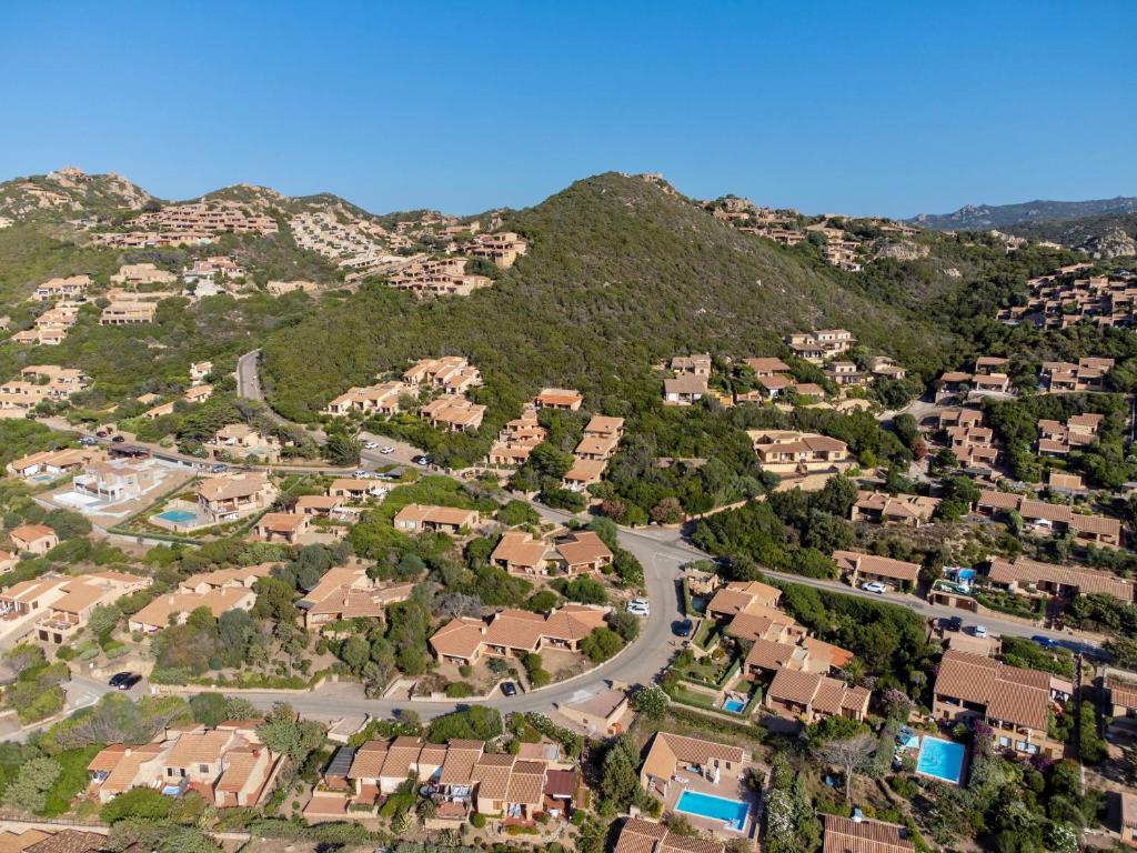 an aerial view of a residential neighborhood with a mountain at ISA-Residence with swimming-pool in Costa Paradiso, apartments 6 beds with private outdoor area in Costa Paradiso