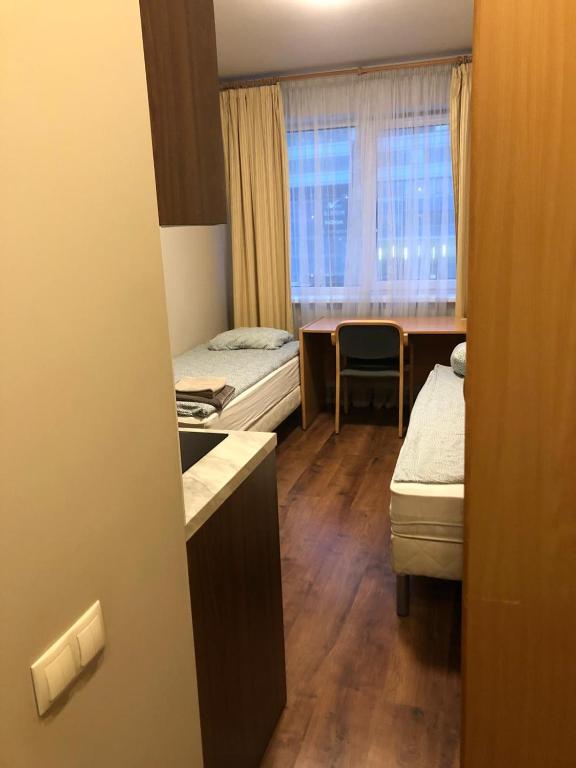 Postel nebo postele na pokoji v ubytování RVR Smart Apartments Riga with self Check-in
