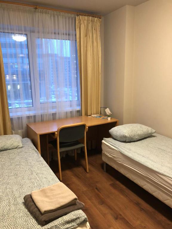 Postel nebo postele na pokoji v ubytování RVR Smart Apartments Riga with self Check-in