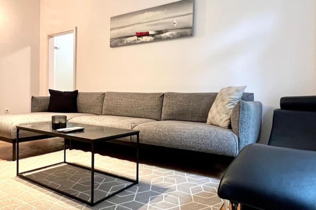 a living room with a couch and a coffee table at Lang's square apartment in Zagreb